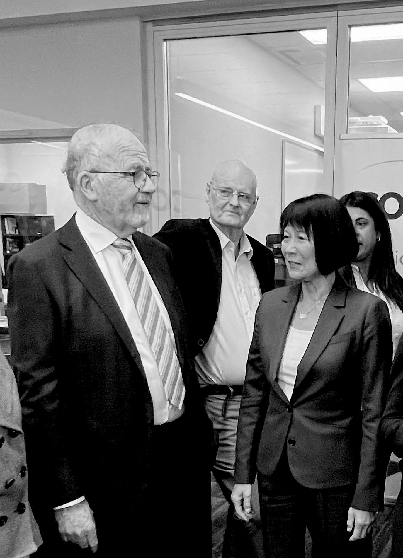 COSTI Board members and Mayor of Toronto standing and talking to each other